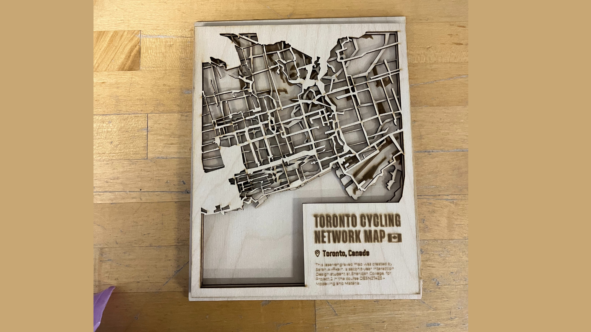 This image shows my finalized engraved cover for the Toronto Cycling Network Map. I decided to build it as a layered piece but hadn’t glued the layers yet, allowing me to check the fit and depth first.