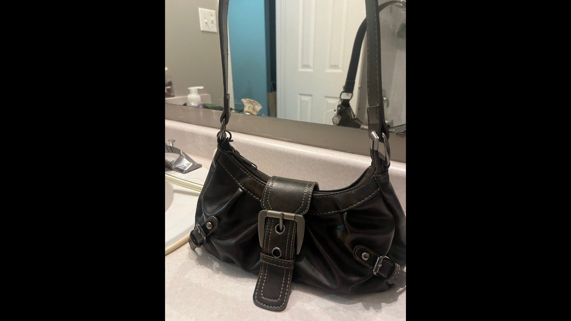 This is my bag. It has a buckle which I wanted to use for the circuit and interaction aspect