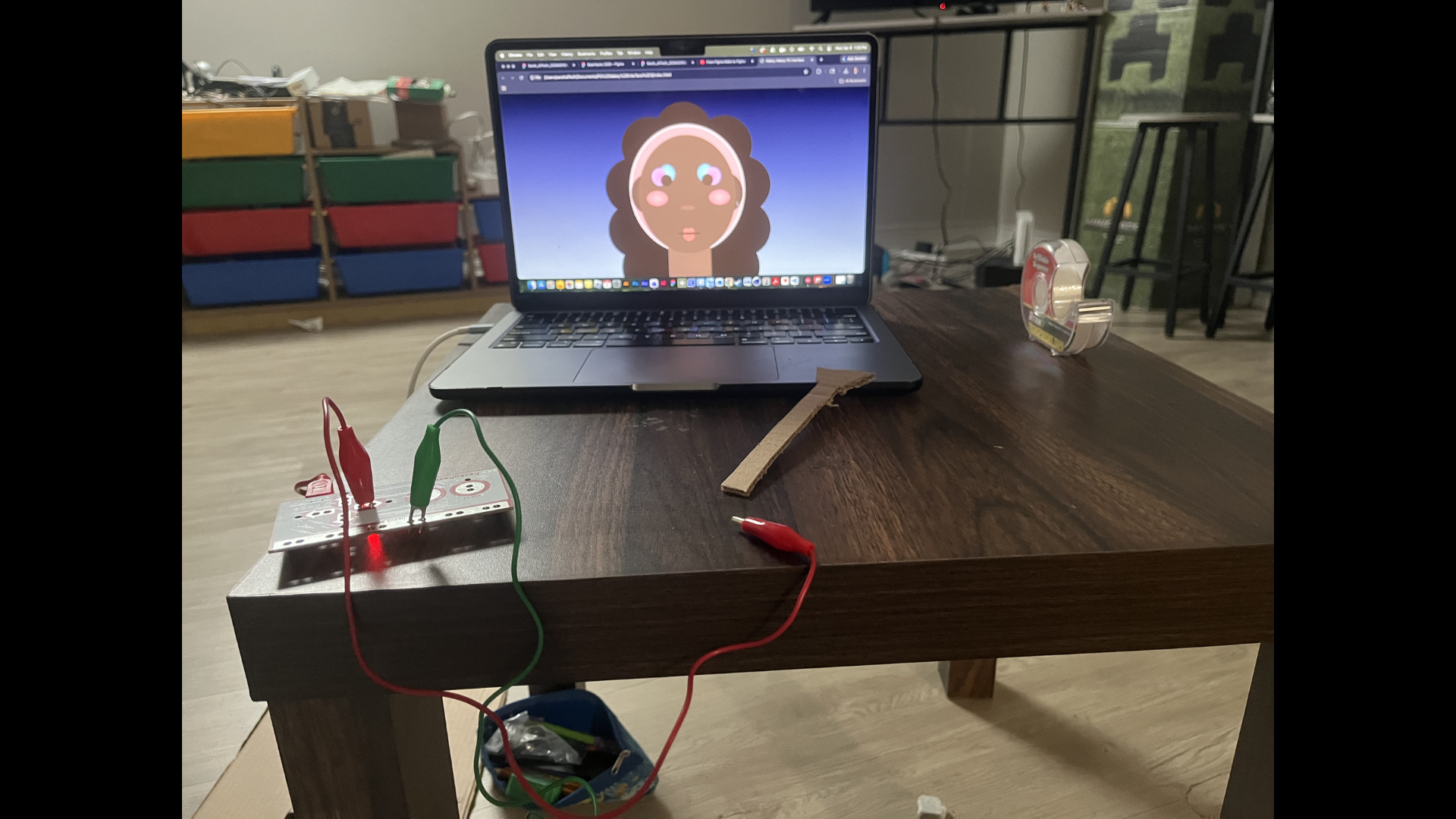 This is me preparing to set up the Makey Makey and my code. I used the guerrilla prototype brush and connected myself to earth using my hand. I covered the lower half of the brush with conductive tape to create a trigger.